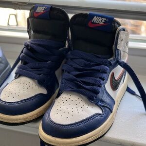 Nike Blue and White Sneakers with Black Swoosh